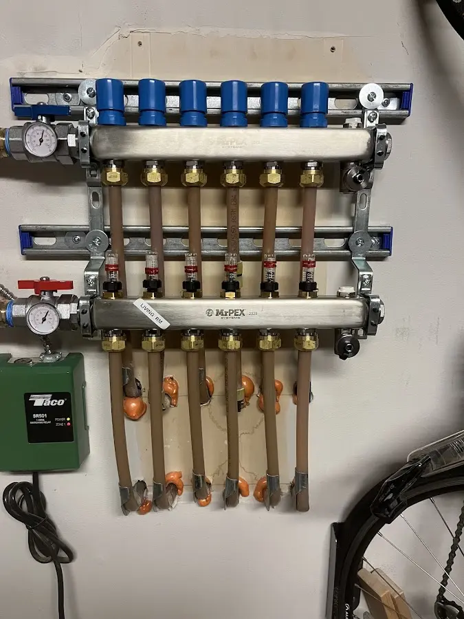 Plumber performing Water Heater Repair at a residential property in Ravena